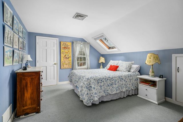 a bathroom with a sink a toilet and shower curtain