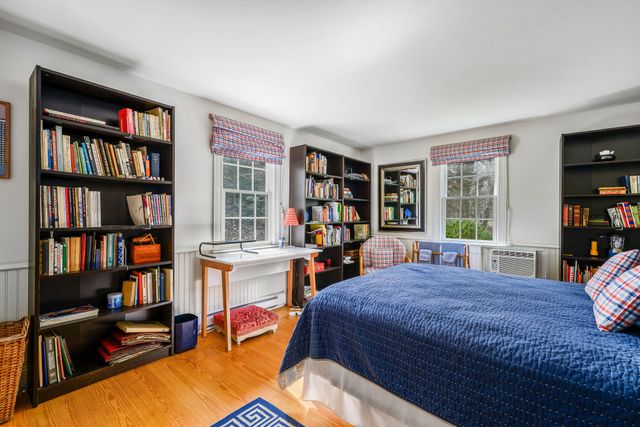 a bedroom with two beds and painted walls