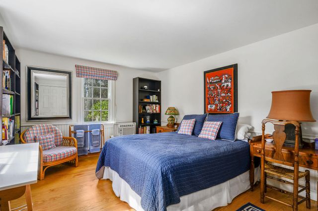 a bathroom with a sink a mirror and a shower