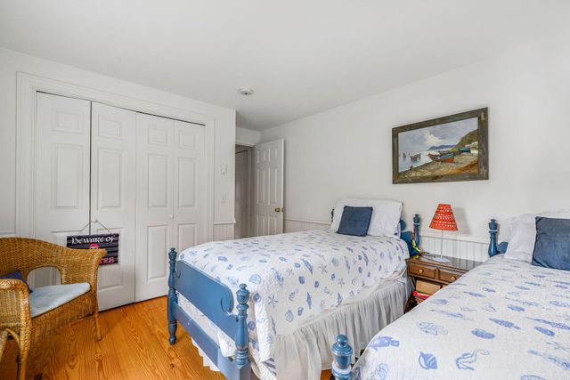 a view of a swimming pool with a patio and a yard