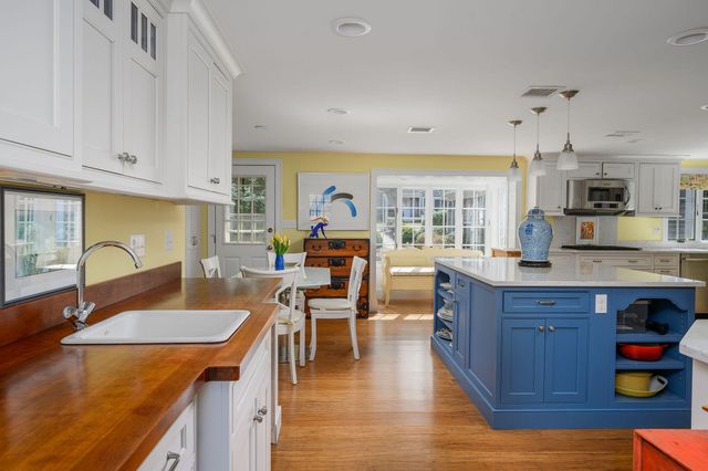 a kitchen with stainless steel appliances granite countertop a stove and a sink