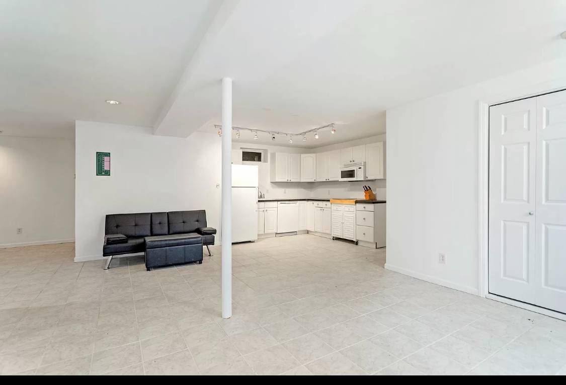 1 High Point Road East Hampton, NY 11937 - Photo 12 of 12 a view of kitchen with cabinets microwave and stove top oven