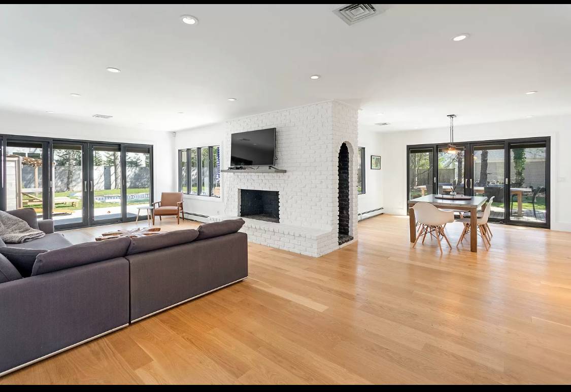 1 High Point Road East Hampton, NY 11937 - Photo 3 of 12 a living room with furniture and a flat screen tv