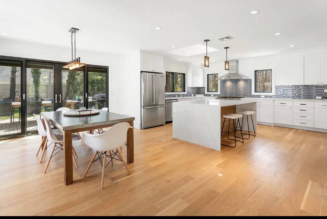 1 High Point Road East Hampton, NY 11937 - Photo 4 of 12 a kitchen with refrigerator and chairs
