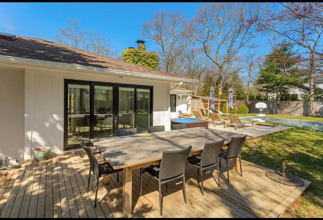1 High Point Road East Hampton, NY 11937 - Photo 9 of 12 a view of a patio with table and chairs and potted plants
