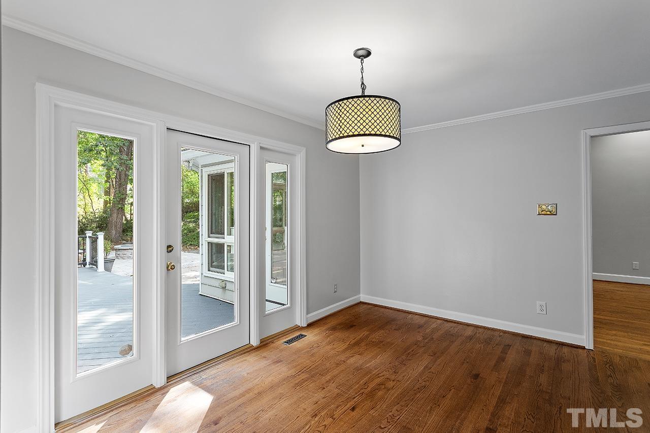 59 Kimberly Drive Durham, NC 27707 - Photo 20 of 68 a view of empty room with wooden floor