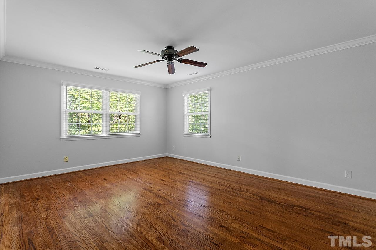 59 Kimberly Drive Durham, NC 27707 - Photo 30 of 68 a view of empty room with wooden floor and fan
