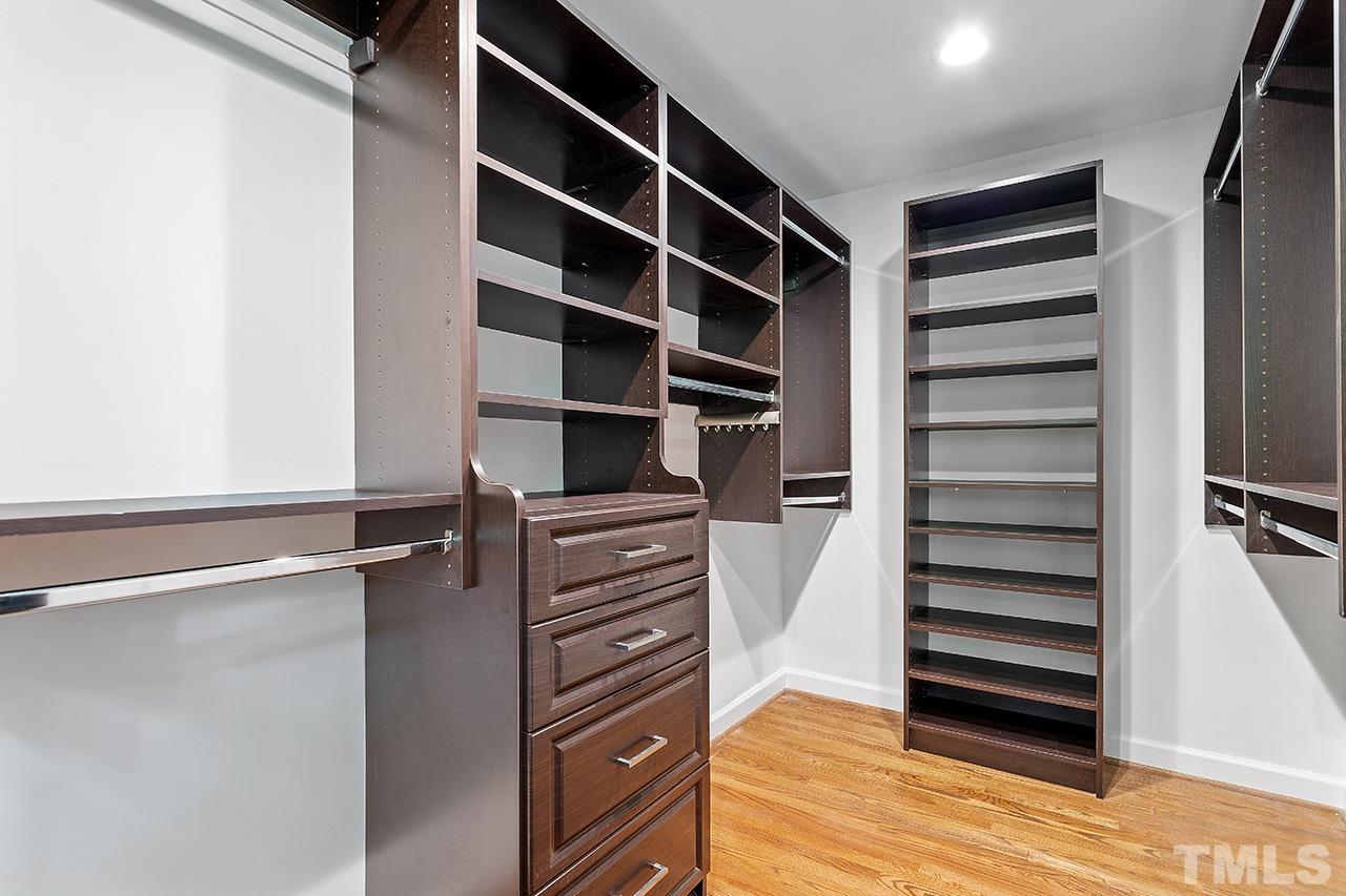 59 Kimberly Drive Durham, NC 27707 - Photo 32 of 68 a view of walk in closet with empty racks