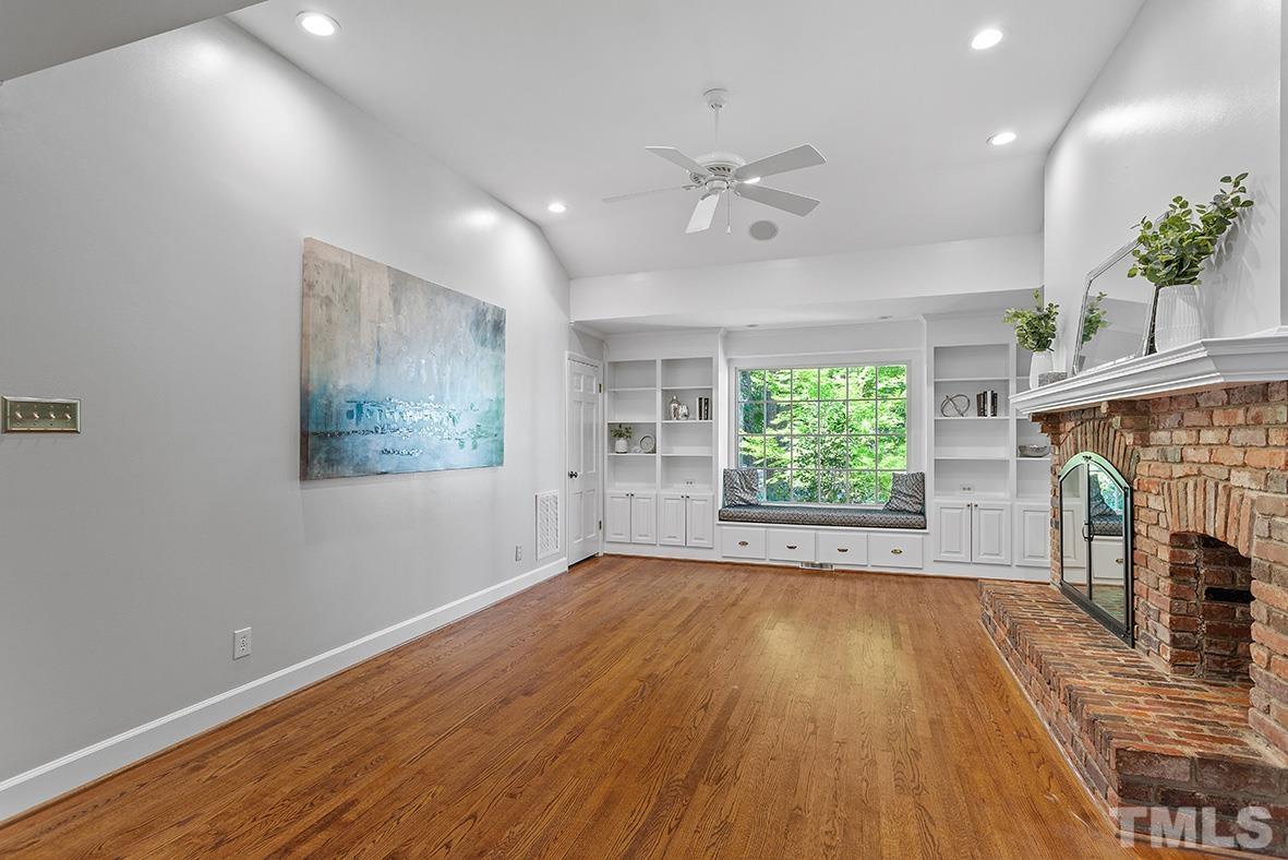 59 Kimberly Drive Durham, NC 27707 - Photo 40 of 68 a view of empty room with wooden floor and fan
