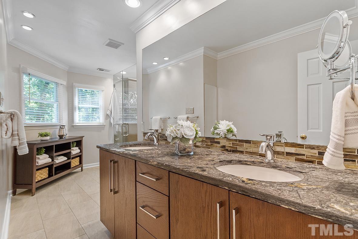 59 Kimberly Drive Durham, NC 27707 - Photo 42 of 68 a bathroom with a granite countertop sink and a mirror