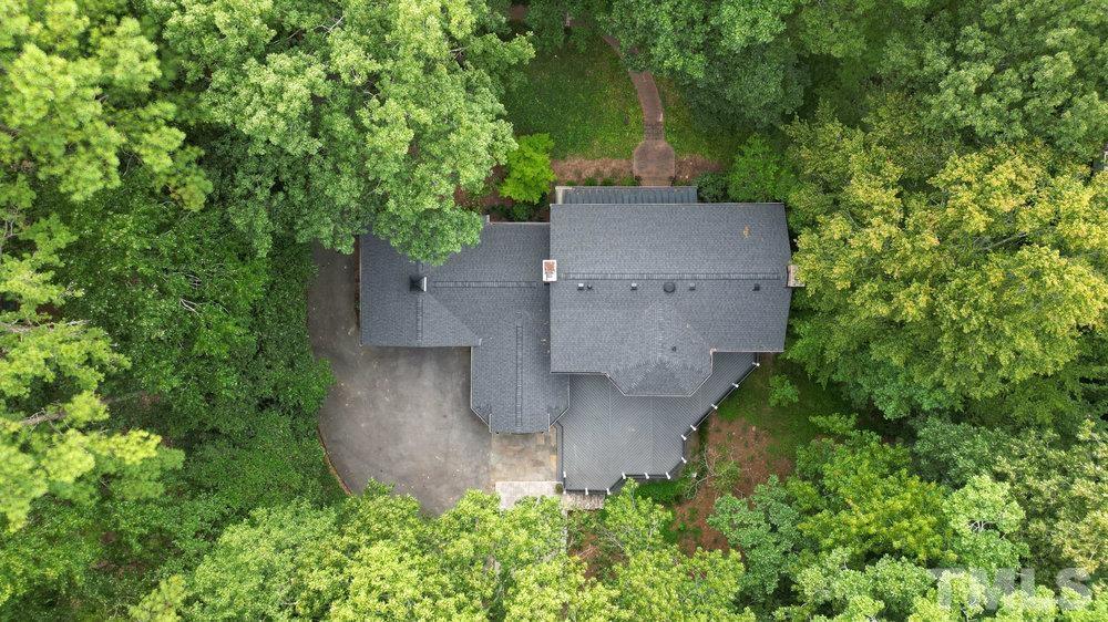 59 Kimberly Drive Durham, NC 27707 - Photo 55 of 68 an aerial view of a house with a yard and large trees