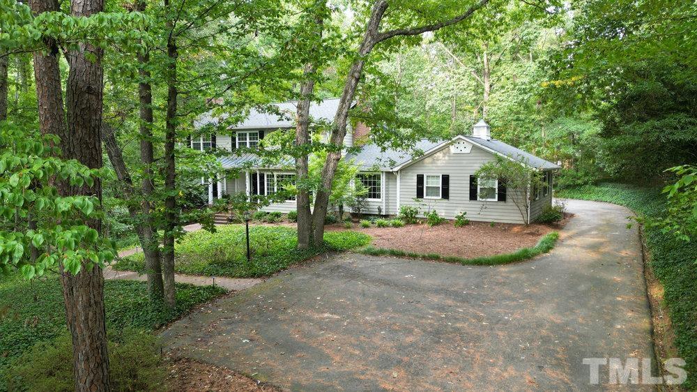 59 Kimberly Drive Durham, NC 27707 - Photo 61 of 68 a front view of a house with yard and green space