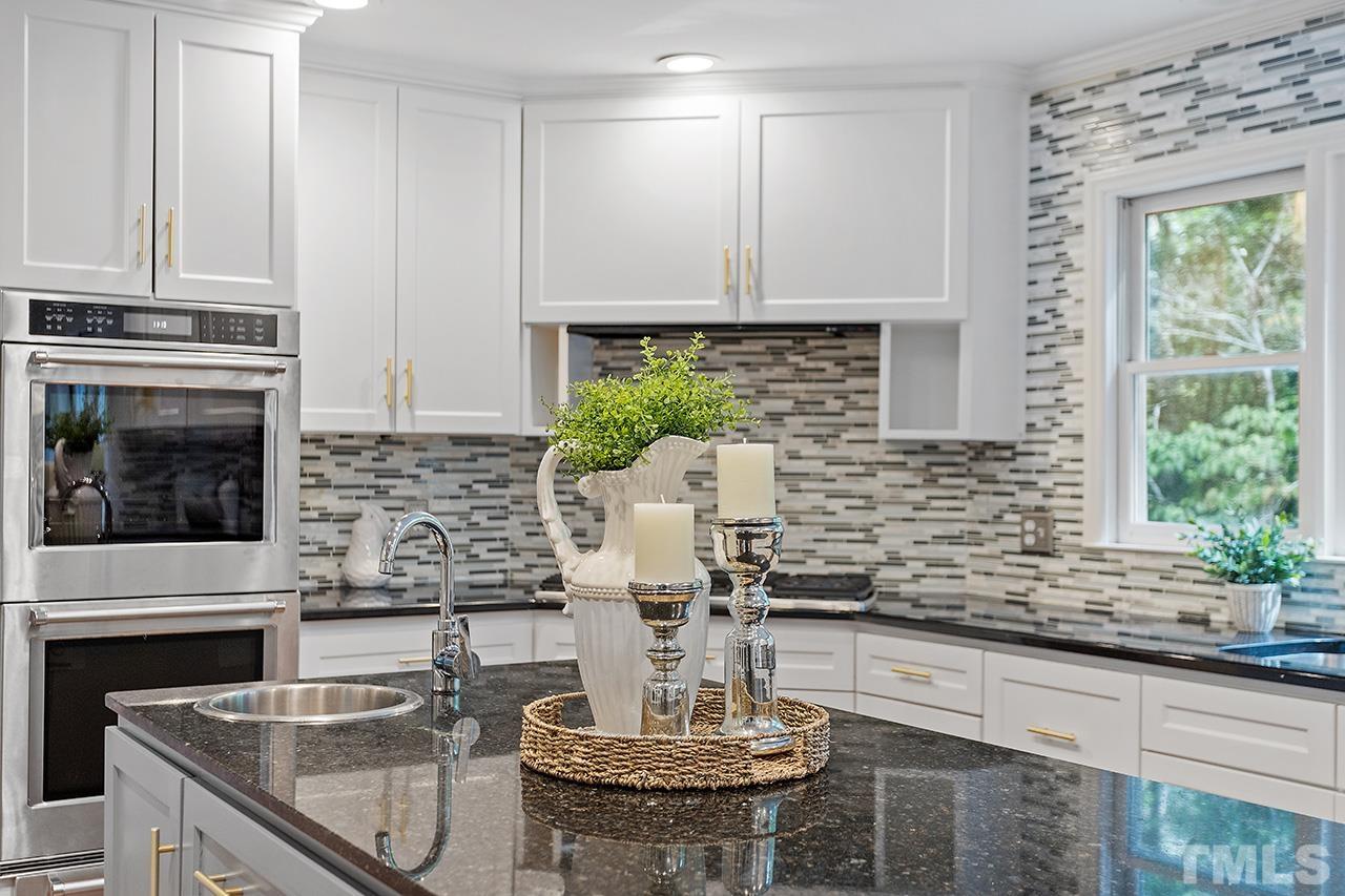 59 Kimberly Drive Durham, NC 27707 - Photo 7 of 68 a kitchen with a stove and a white cabinets