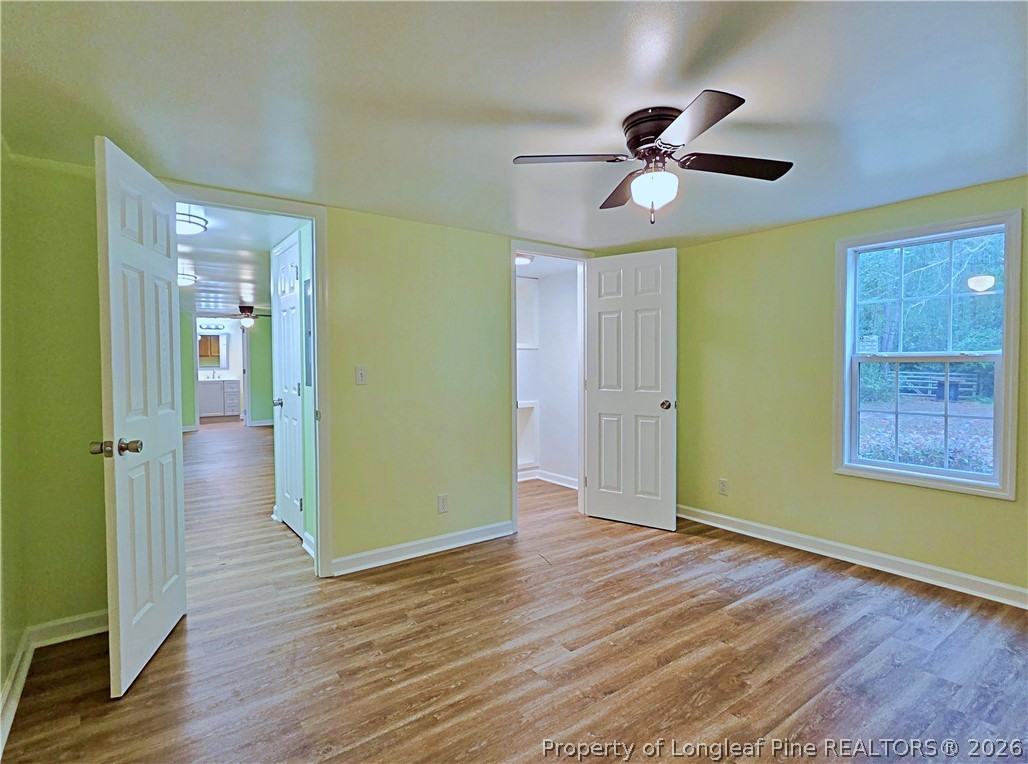 1031 Pine Acres Road White Oak, NC 28399 - Photo 12 of 29 wooden floor in an empty room with a window