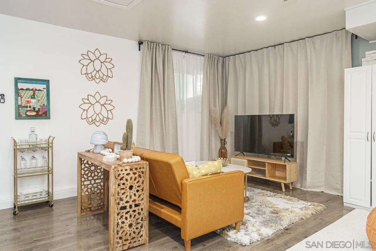 9026 Avocado Street Spring Valley, CA 91977 - Photo 11 of 27 a living room with furniture and a flat screen tv