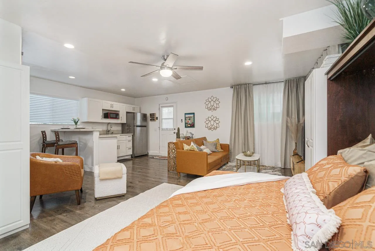 9026 Avocado Street Spring Valley, CA 91977 - Photo 14 of 27 a bedroom with furniture and a chandelier