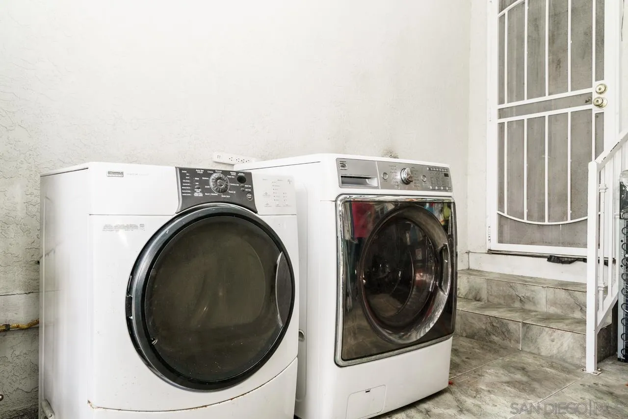 9026 Avocado Street Spring Valley, CA 91977 - Photo 23 of 27 a utility room with dryer and washer