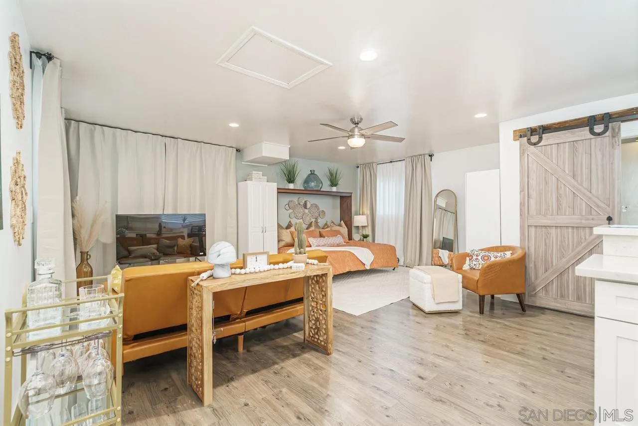 9026 Avocado Street Spring Valley, CA 91977 - Photo 6 of 27 a room with furniture and a wooden floor