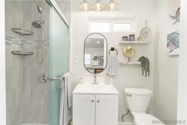 a large bedroom with a bed and window