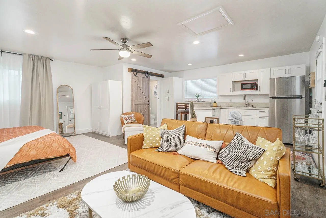 9026 Avocado Street Spring Valley, CA 91977 - Photo 8 of 27 a large bedroom with a bed and window