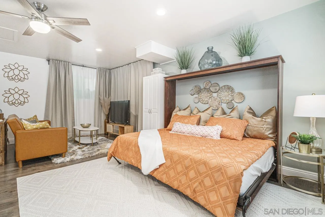 9026 Avocado Street Spring Valley, CA 91977 - Photo 9 of 27 a bedroom with a bed couch and window