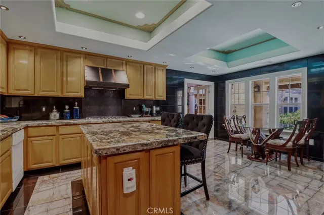 a bathroom with a double vanity sink a toilet and shower
