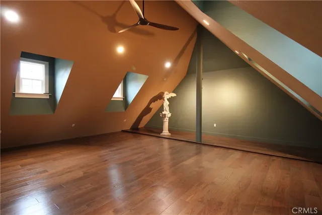 a view of a workspace with furniture and a potted plant