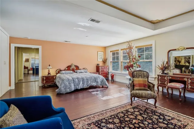 a bedroom with a bed and a dresser