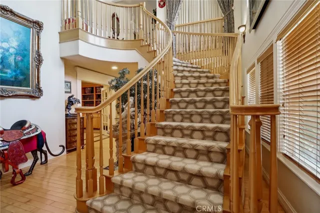 a bathroom with a granite countertop tub sink a mirror and a shower