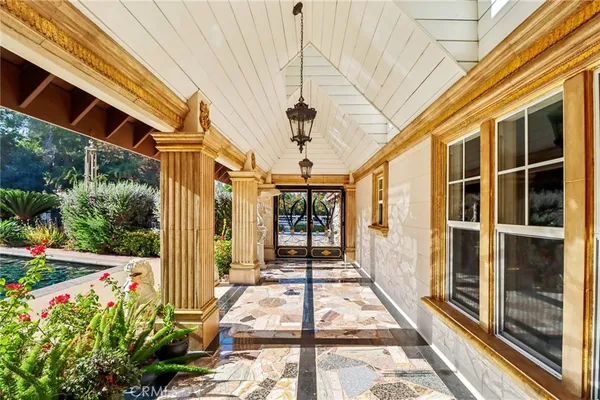 a view of entryway with a table and a potted plant