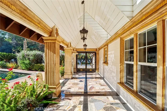 a view of entryway with a table and a potted plant