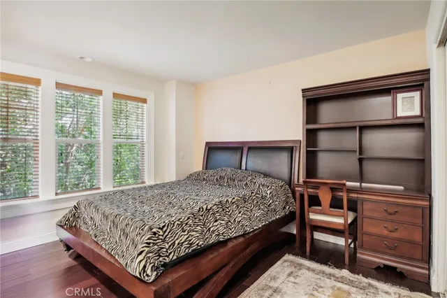 a white bench sitting in front of a white building