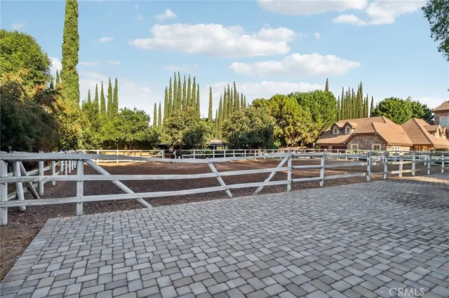 a garden with trees in front of it