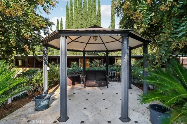 an aerial view of residential houses with outdoor space and street view