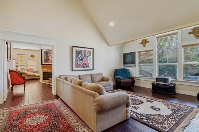 a view of a dining room with furniture and chandelier