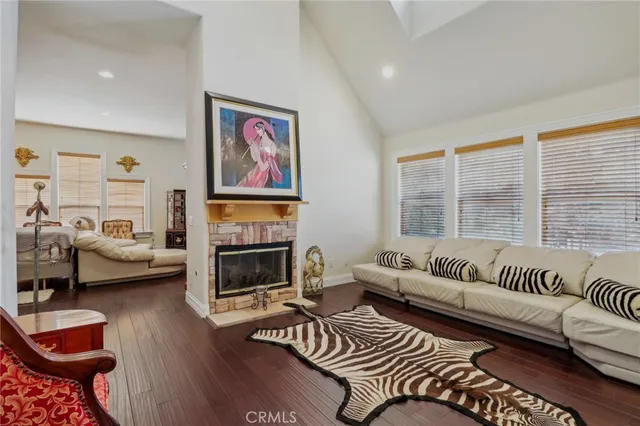 a kitchen with granite countertop wooden cabinets stainless steel appliances a sink and a window