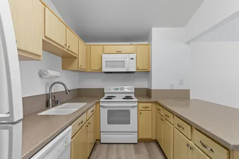 a view of cabinets and wooden floor