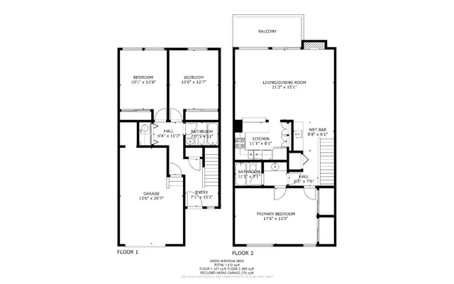 an empty room with wooden floor fireplace and windows