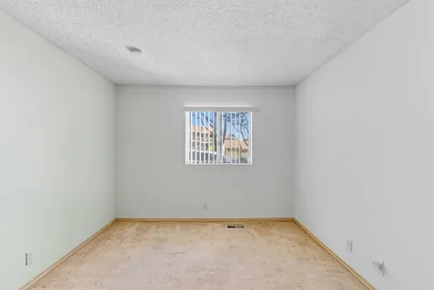 a couple of potted plants in front of door