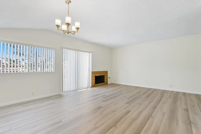 a kitchen with a refrigerator and a sink