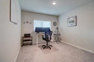 a view of a workspace with furniture