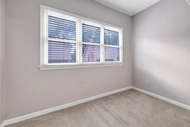 a bathroom with a bathtub sink and mirror