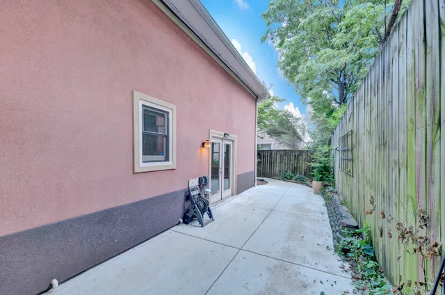 a view of a pathway with a house in the background