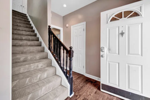 a view of entryway with wooden floor