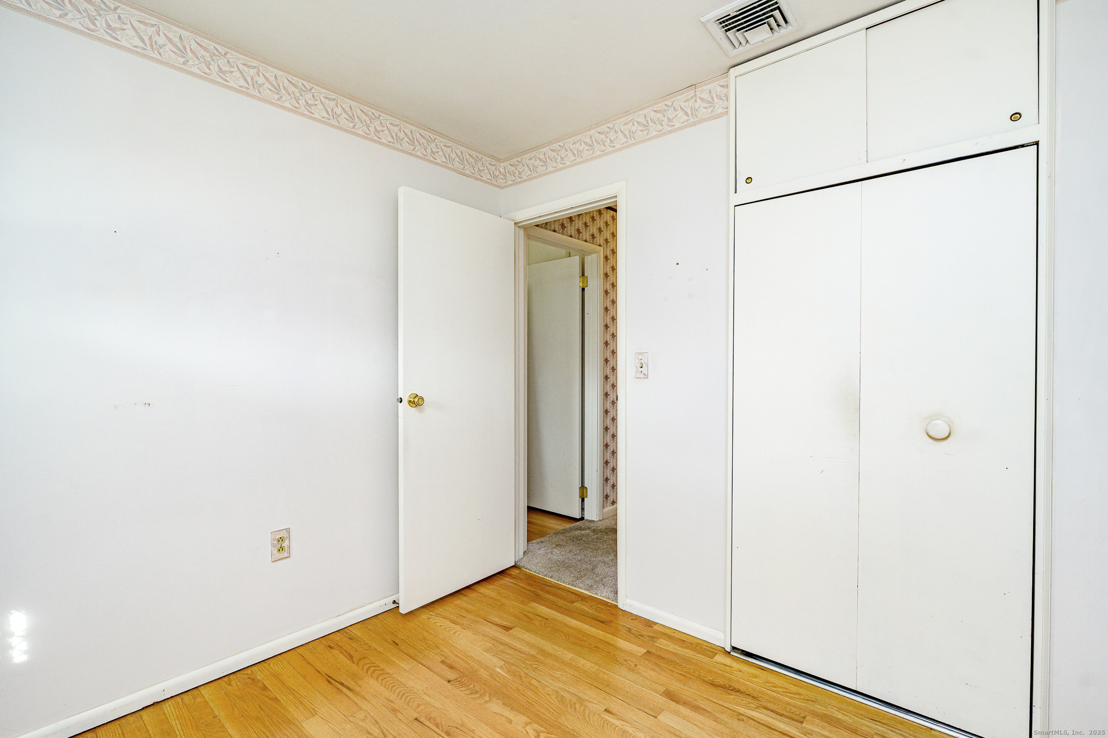 38 Toper Road Plainfield, CT 06374 - Photo 13 of 35 a view of a big room with closet and wooden floor