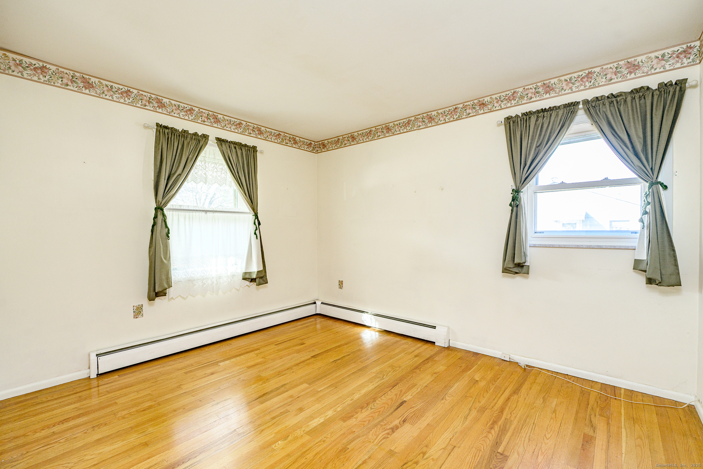 38 Toper Road Plainfield, CT 06374 - Photo 14 of 35 a view of a room with wooden floor and small window