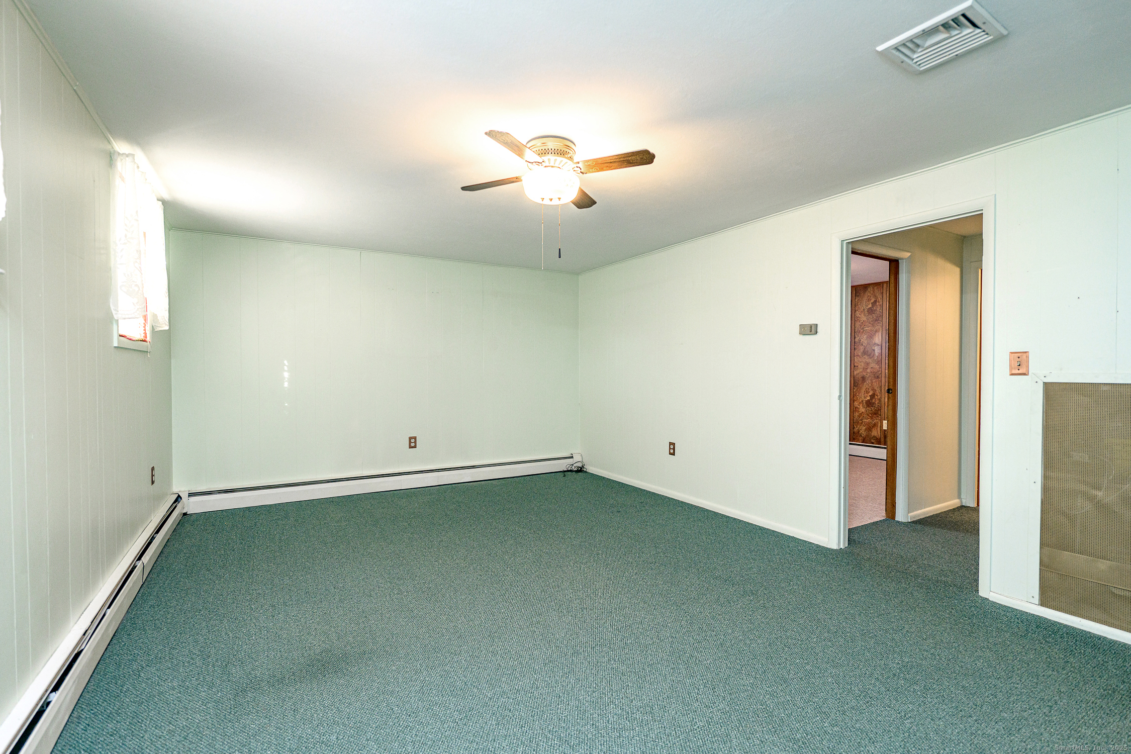 38 Toper Road Plainfield, CT 06374 - Photo 21 of 35 wooden floor in an empty room with a window