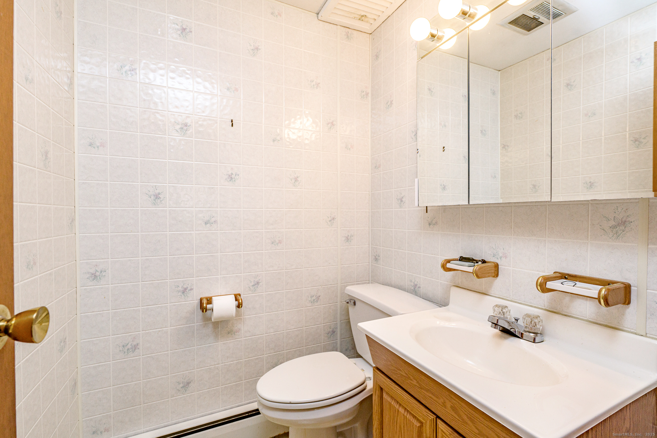 38 Toper Road Plainfield, CT 06374 - Photo 25 of 35 a bathroom with a sink a toilet and shower curtain