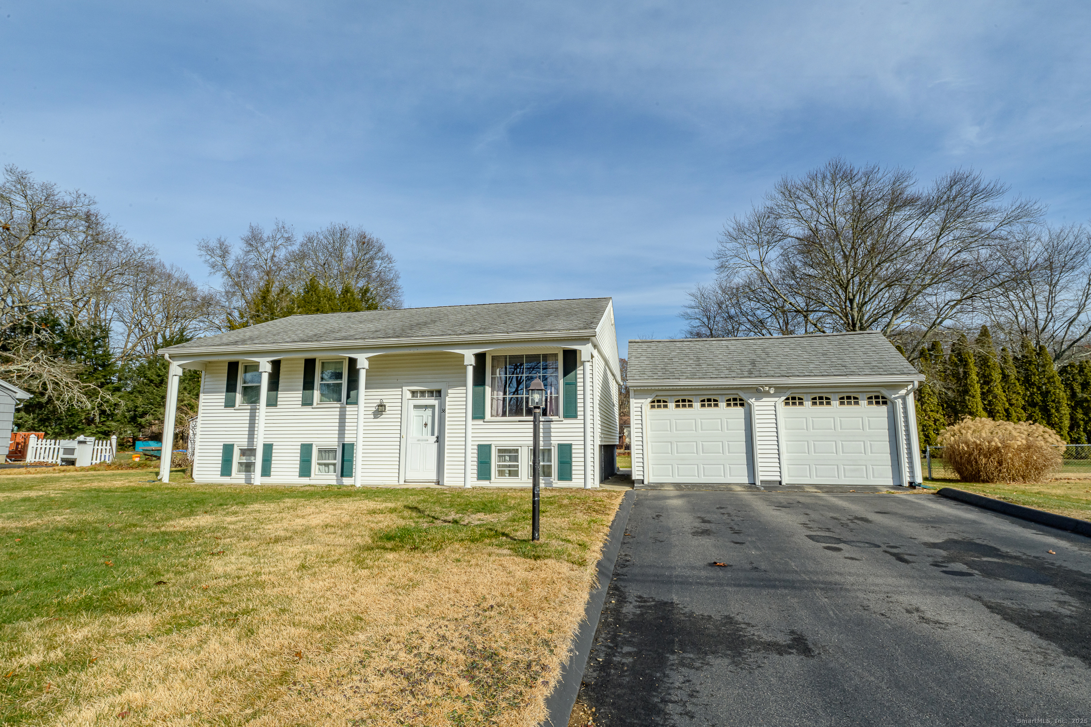 38 Toper Road Plainfield, CT 06374 - Photo 34 of 35 a front view of a house with a garden