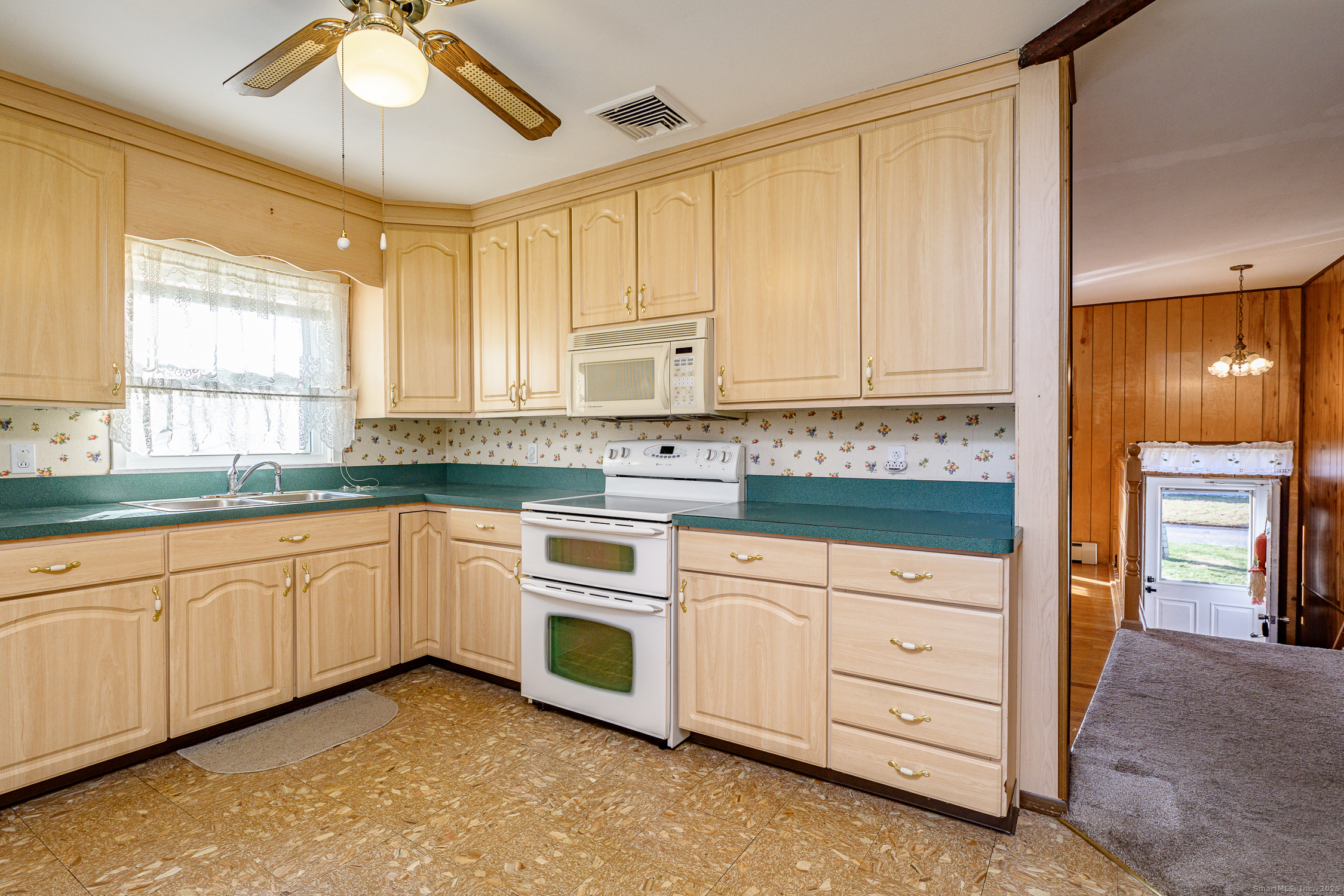 38 Toper Road Plainfield, CT 06374 - Photo 8 of 35 a kitchen with granite countertop white cabinets and stainless steel appliances